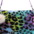 Multicolored leopard print bag with a fluffy keychain on a white background